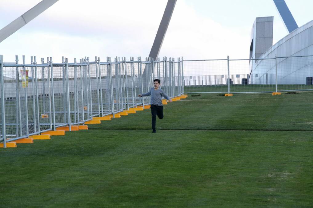 A temporary fence is installed at Parliament House.  Photo: Andrew Meares