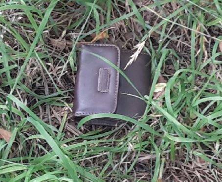 A brown 'Rosetti' purse located in the laneway between 108 and 110 Badimara Street, Fisher.