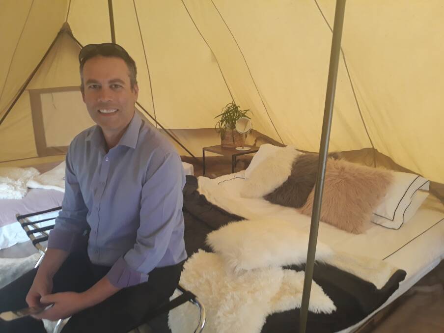 ACT Parks and Conservation Director, Daniel Iglesias inside the tent set up in Garema Place on Friday. Photo: Megan Doherty