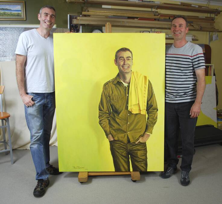 Ross Townsend (right) at his Gordon studio with the retired yellow Wiggle, Greg Page, and his portrait, in 2013. Photo: Supplied