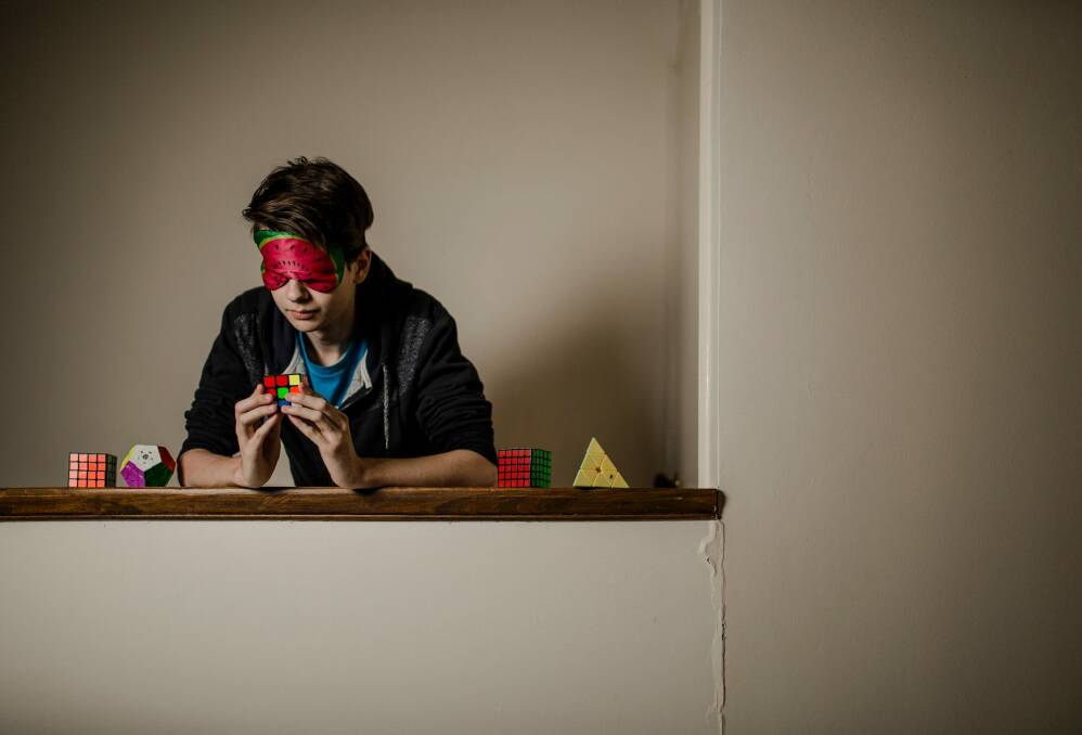Rubik's cube genius Jayden McNeill can now solve the puzzle while wearing a blindfold. Photo: Jamila Toderas