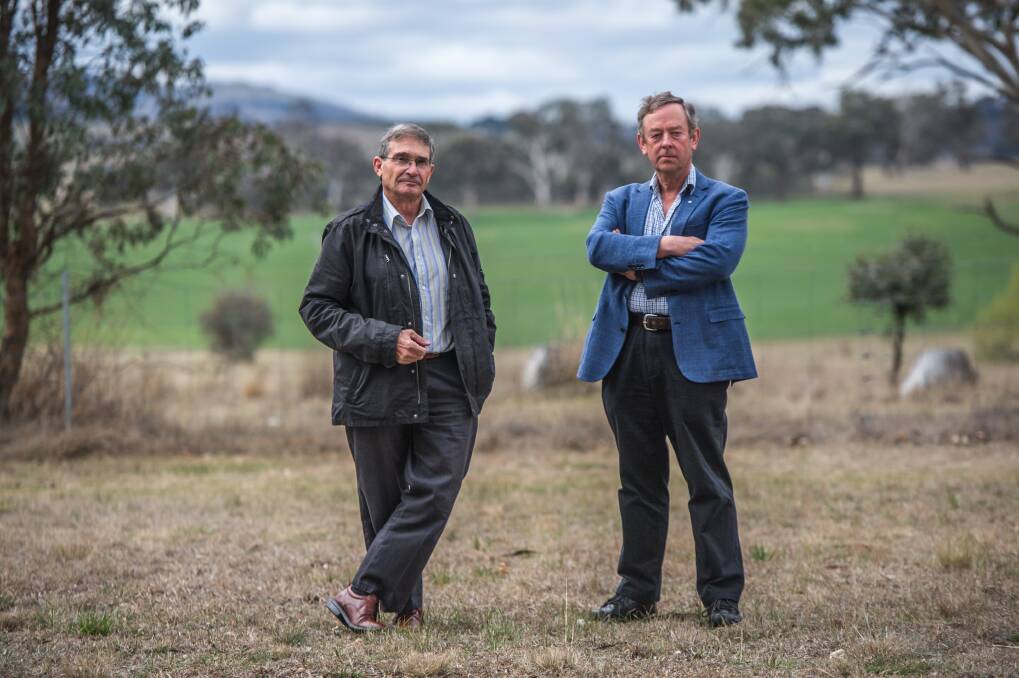 Former Flynn neighbours Robin Eckermann and Peter Toscan have fears of a cancer cluster on properties on former sheep dip site where theier homes were established.  Photo: Karleen Minney