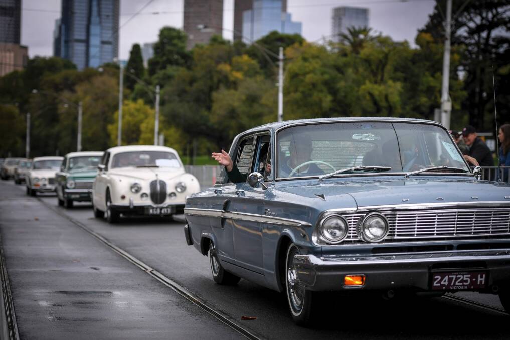 Classic cars take veterans at the start of the Anzac Day march in Melbourne.  Photo: Eddie Jim