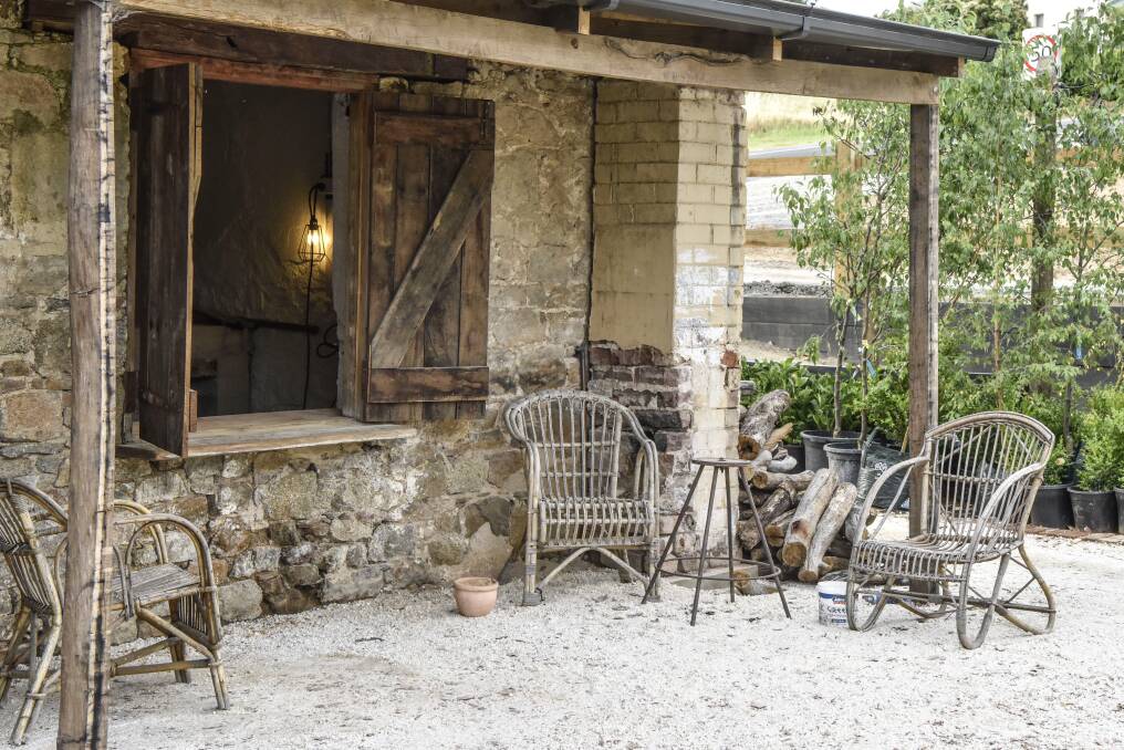 Fresh bread and pizza is served to customers through the open window of this cottage attached to The Sir George.  Photo: Rachael Lenehan Photography