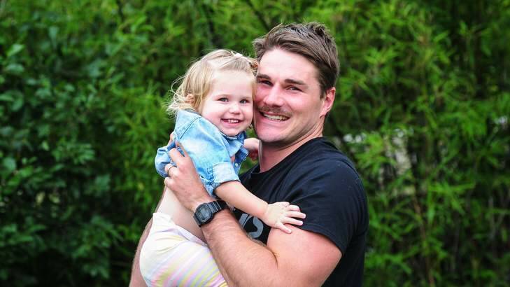 Ben Mowen with his 18-month-old daughter Eleanor at his home. Photo: Katherine Griffiths