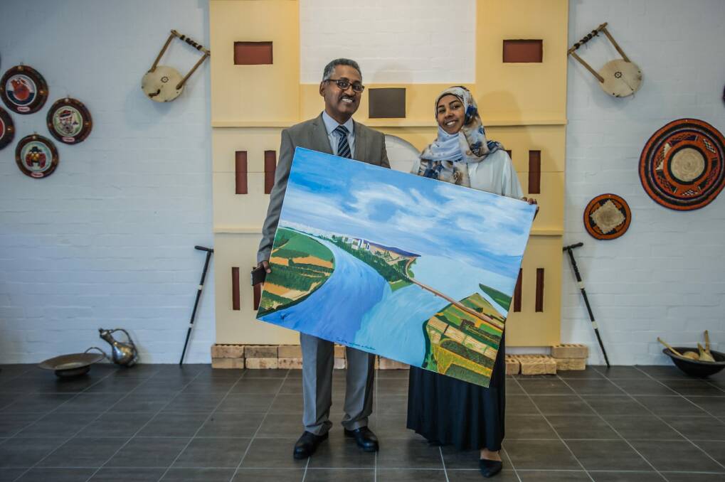 New Sudanese ambassador Dr Ibrahim Baroudi, his wife Riham Abdullah Mahmoud Elnazir, and their exhibition - the ambassador's wife made some of the art in the exhibition. Photo: karleen minney
