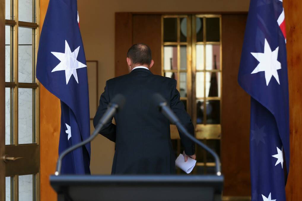 Tony Abbott gave no indication of whether he would continue on the backbench. Photo: Alex Ellinghausen