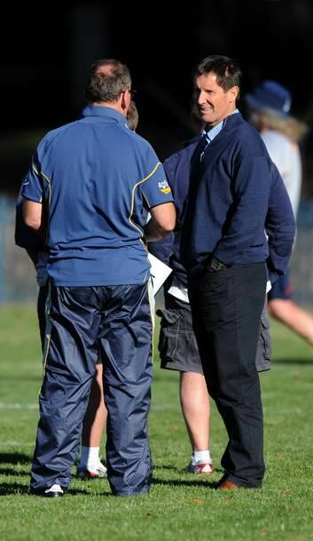 Wallabies coach Robbie Deans, right, chats with Brumbies coach Jake White at Brumbies training on Tuesday. Photo: Graham Tidy