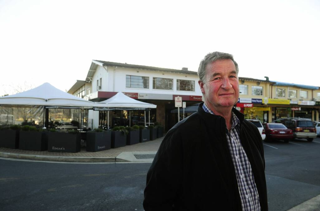 Jeff Darwin cannot demolish the top floor at Ainslie shops without massive cost and huge disruption to Edgar's Inn and wants to know whether he can clean the flat instead. Photo: Melissa Adams