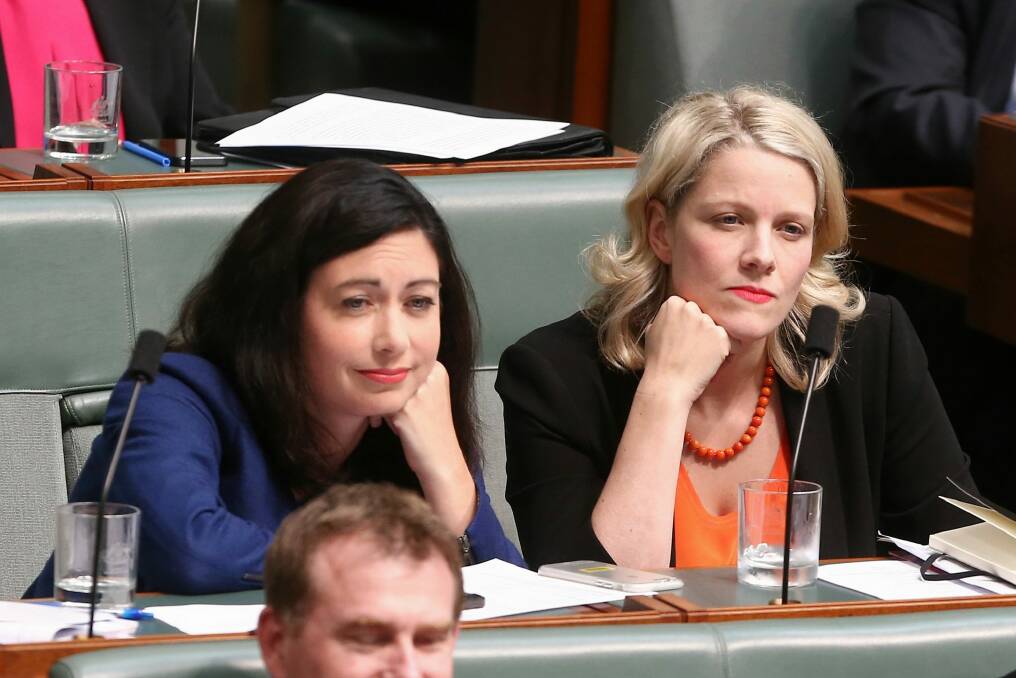 Labor MPs Terri Butler and Clare O'Neil listen during question time on Monday. Photo: Alex Ellinghausen
