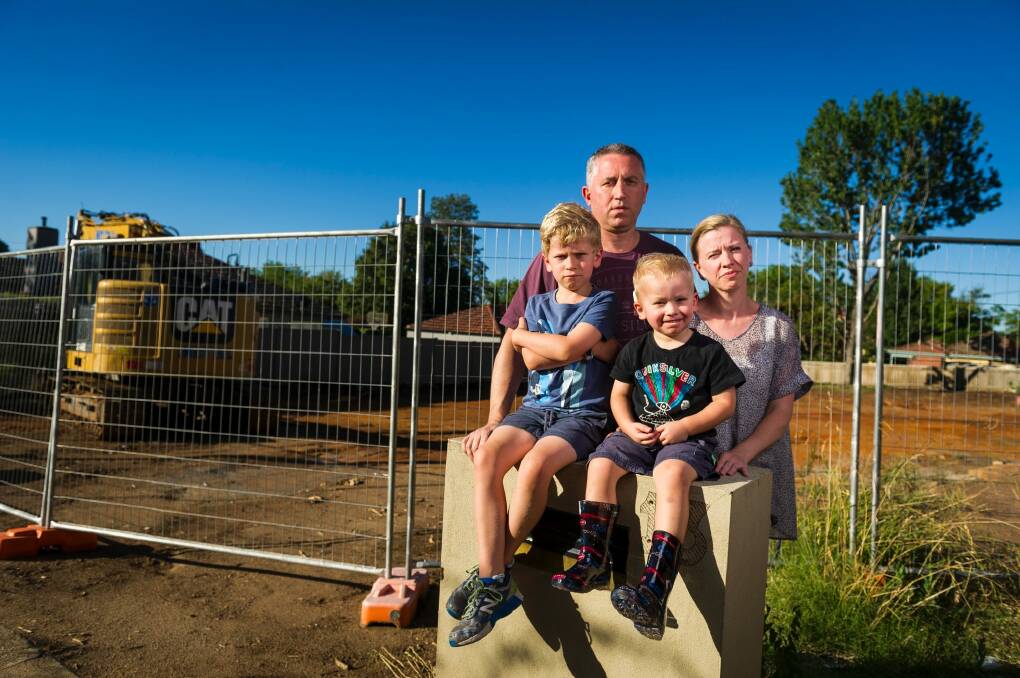 Anthony Steve, and Clare Steve with their kids Alexander Steve (7) and Oliver Steve (3) paid $1.6 million for a Mr Fluffy block however asbestos has been found on the land. Photo: Dion Georgopoulos Photo: Dion Georgopoulos