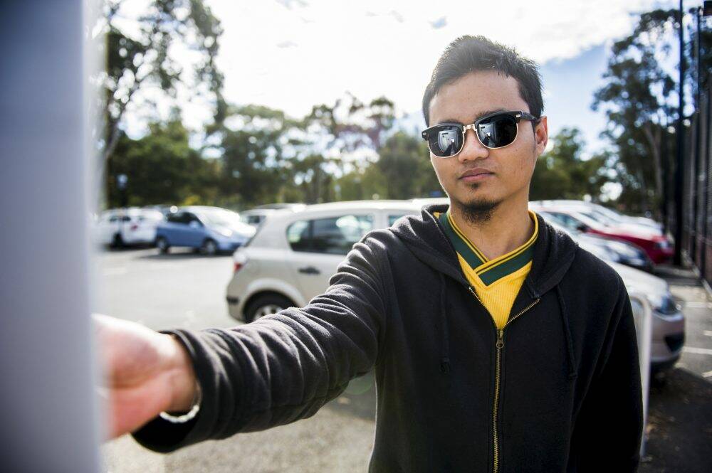 ANU student Salman Mokhtar pays for parking. Photo: Rohan Thomson