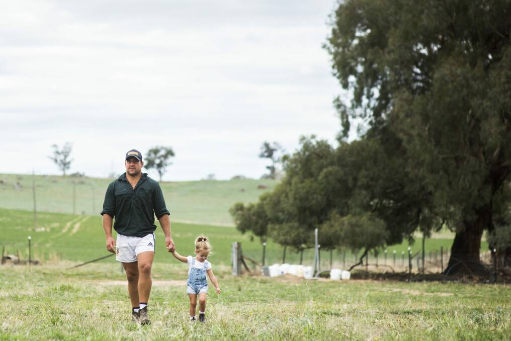 Brumbies hooker Josh Mann-Rea with his daughter Avery at home in Jugiong, NSW.  Photo: Rohan Thomson