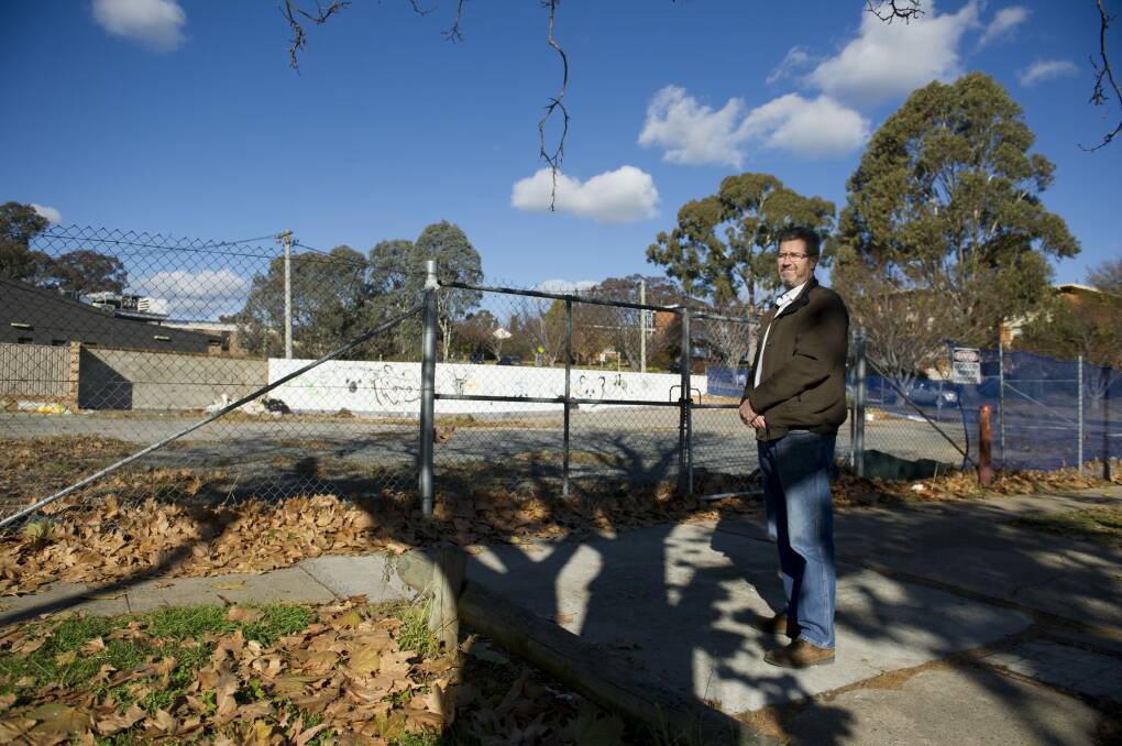 Campbell resident Mark Anderson is leading the charge for a former petrol station site next to the local shops to be cleaned up. Photo: Jay Cronan