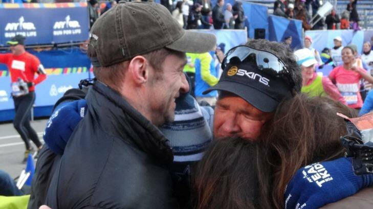 Well done mate: An emotional Gus Worland is congratulated by Hugh Jackman after completing the NYC marathon in six hours, 29 minutes. Photo: Triple M’s Grill Team