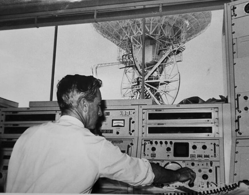 Barnard Schrivener at the controls of the antenna at Honeysuckle Creek in 1968. Photo: Supplied