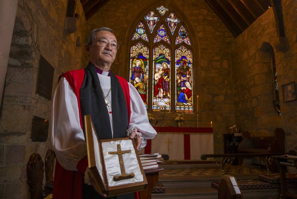 Poignant occasion: Bishop Andrew Nakamura of Kobe with a bamboo cross in St John's Anglican Church, Reid.
 Photo: Matt Bedford