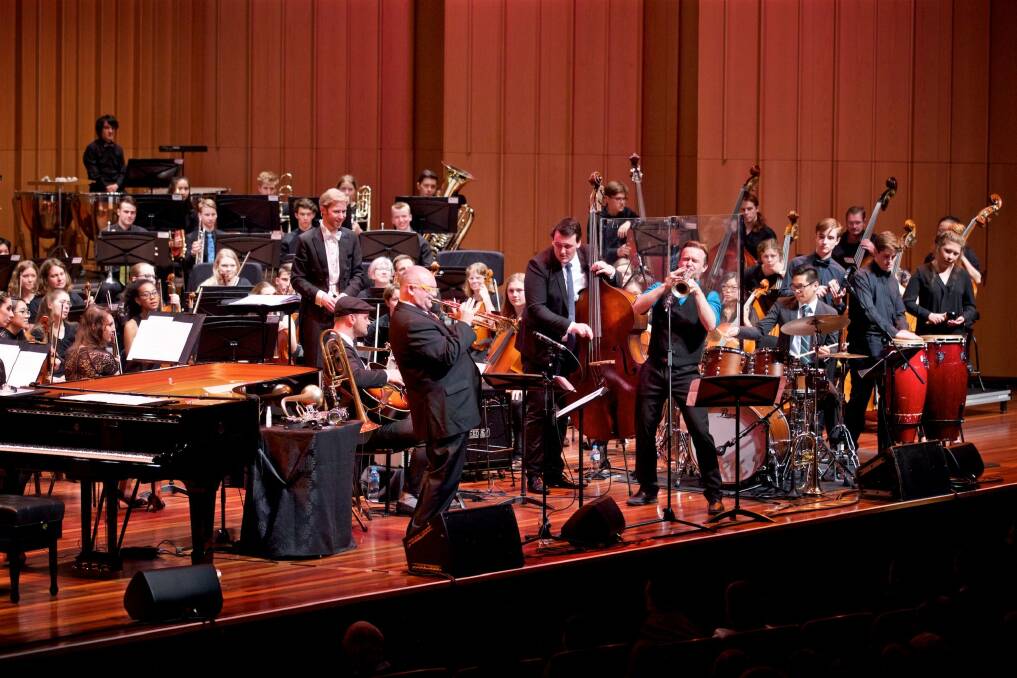 James Morrison, standing centre left, Zach Raffan, standing centre right, soloists and the Canberra Youth Orchestra perform at Llewellyn Hall.  Photo: William Hall