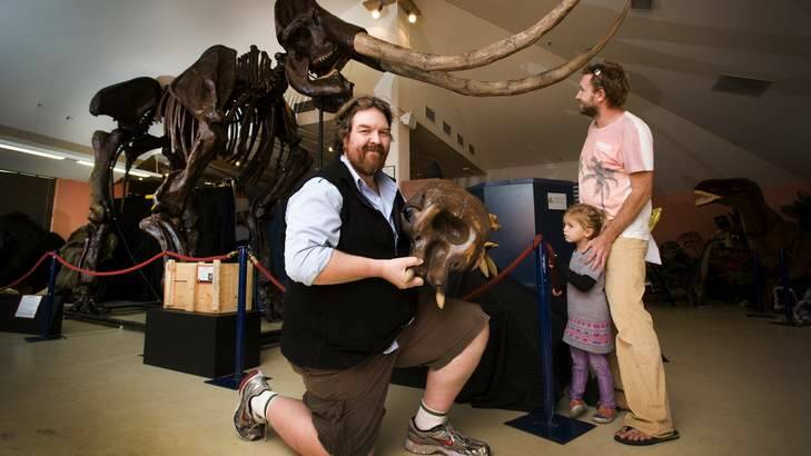 Education manager Phil Hore with a baby mammoth skull in front of the National Dinosaur Museum's newly acquired Stegodon. Photo: Elesa Kurtz