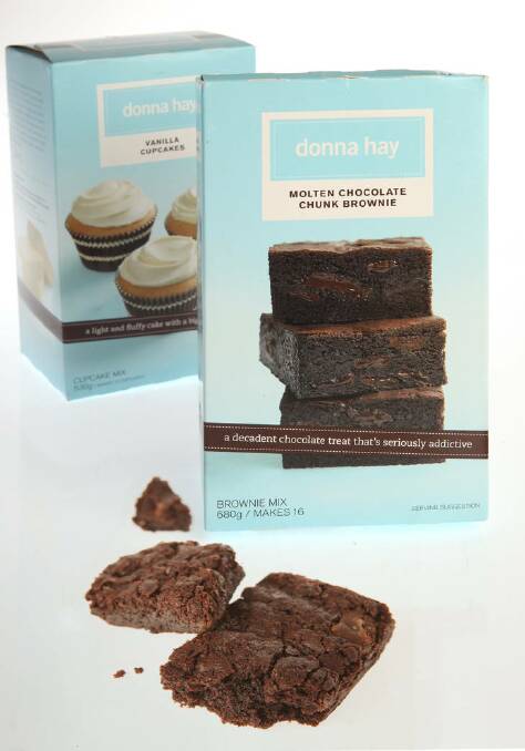 Hay has built herself a culinary empire... pictured are Donna Hay Molten Chocolate Chunk Brownie and Vanilla Cupcake kits. Photo: Melanie Faith Dove