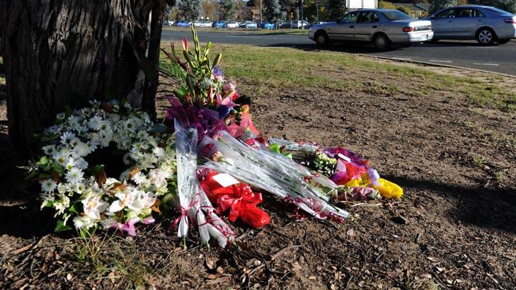 Flowers were left at the scene after the Yamba Drive fatality. Photo: Graham Tidy