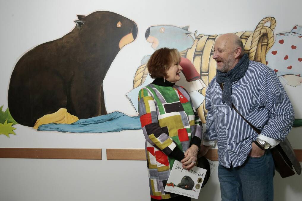 Author Jackie French and artist Bruce Whatley with one of the wombat images in the neonatal intensive care unit at the Centenary Hospital for Women and Children.   Photo: Jeffrey Chan