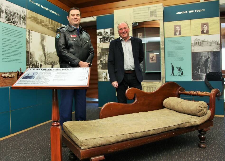 New home for Nelson's lounge; Acting Hume LAC commander Evan Quarmby and Peter Zantis with the Nelson Lounge at the NSW Police Academy in Goulburn. Photo: Goulburn Post