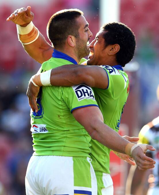 Paul Vaughan and Sia Soliola celebrate a try during the 34-24 win over the Panthers in round 20. Photo: Getty Images