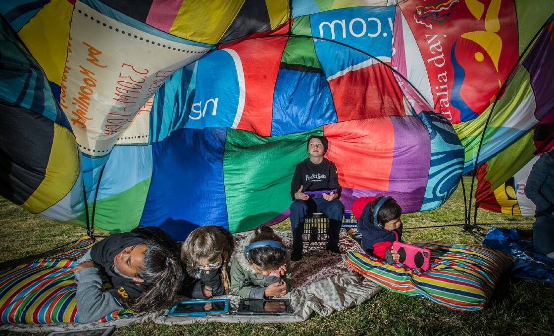Young filmmaker Cooper Magarelli,10, (centre) from New South Wales in the pop-up cubby to present the film PROTECTION on Parliament House lawn  Photo: karleen minney