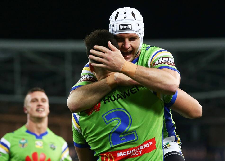 Nikola Cotric of the Raiders celebrates with teammate Jarrod Croker after scoring a try. Photo: Brendon Thorne