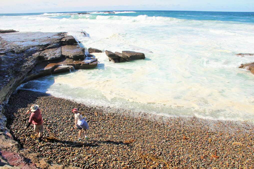 David Salt and his son Henri tossing stones on Singing Stones Beach. Photo: Yvette Salt