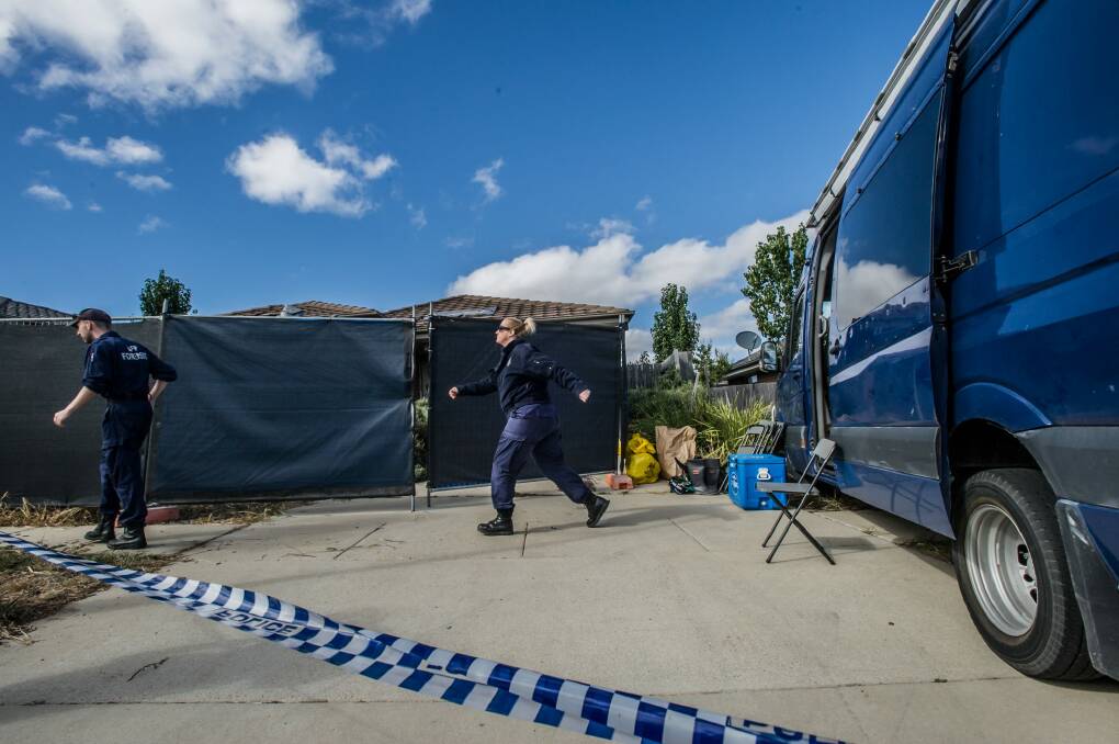 ACT Policing, AFP and forensic officers at the scene of the house fire and triple death in Peter Coppin street, Bonner. Photo: karleen minney