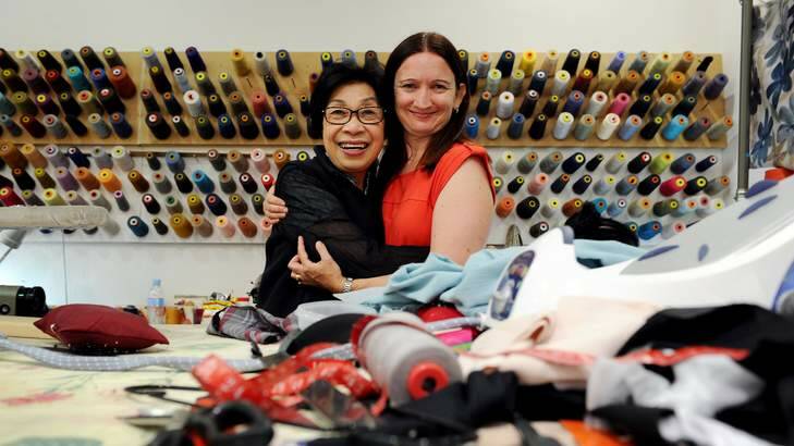 HELPING HAND: Thu Khanh Pham and Samantha Diplock are reunited at Mrs Pham's Woden alterations shop on Tuesday after Sunday's near tragedy, the cause of which is being investigated. Photo: Colleen Petch
