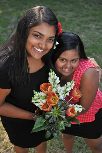 Nip Wijewickrema with her sister  Gayana, 15, who has Down Syndrome. Photo: Graham Tidy