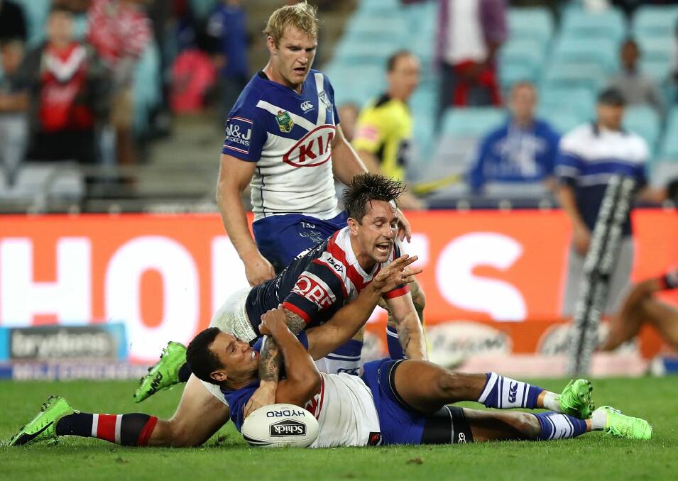 Mitchell Pearce of the Roosters scores the winning try during the round 11 NRL match between the Canterbury Bulldogs and the Sydney Roosters at ANZ Stadium on Sunday. Photo: Getty Images