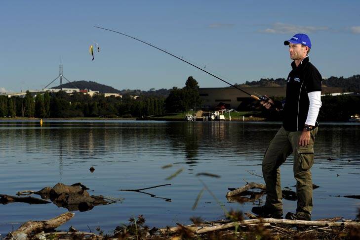 Fishing expert Andrew Mc Govern on the shores of Lake Burley Griffin. Photo: Stuart Walmsley