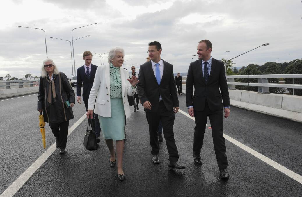 Tamie Fraser, wife of the late Malcolm Fraser, walks along the Malcolm Fraser Bridge and chats to Senator Zed Seselja and ACT Chief Minister Andrew Barr during its official opening. Photo: Graham Tidy