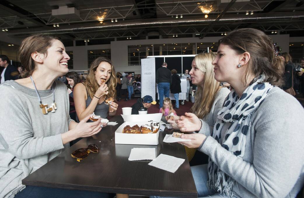 Gabrielle O'Reilly of Waramanga, Rhiannon Savage of Queanbeyan, Sarah O'Reilly of Maquarie and Martha Piper of Page enjoy some scrolls at the expo on Saturday.  Photo: Elesa Kurtz