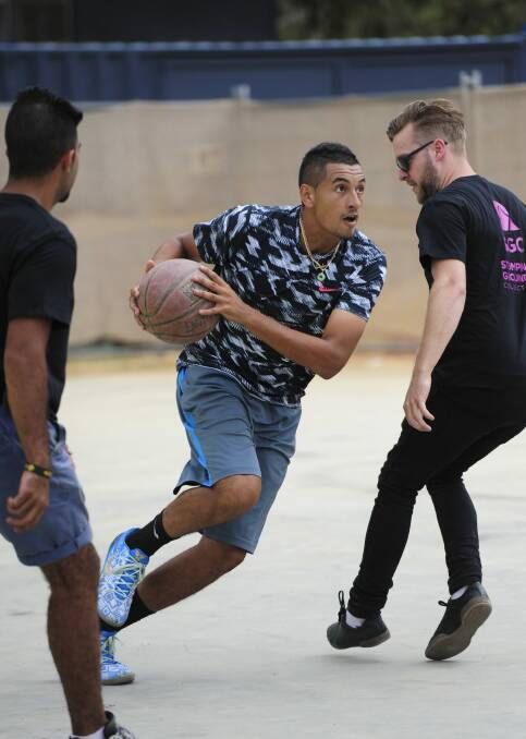A different court: Australian tennis star Nick Kyrgios helps launch the Westside precinct at Acton Park with a celebrity basketball game on Tuesday.
 Photo: Graham Tidy