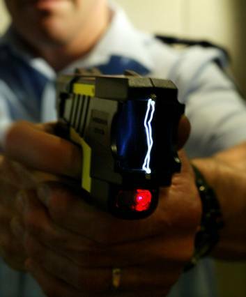 File photograph of police officer demonstrating the use of a Taser stun gun. Photo: Craig Abraham
