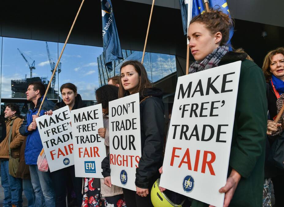 Union and community members protest against the proposed China-Australia Free Trade Agreement at a rally in Melbourne in July. Photo: Vince Caligiuri