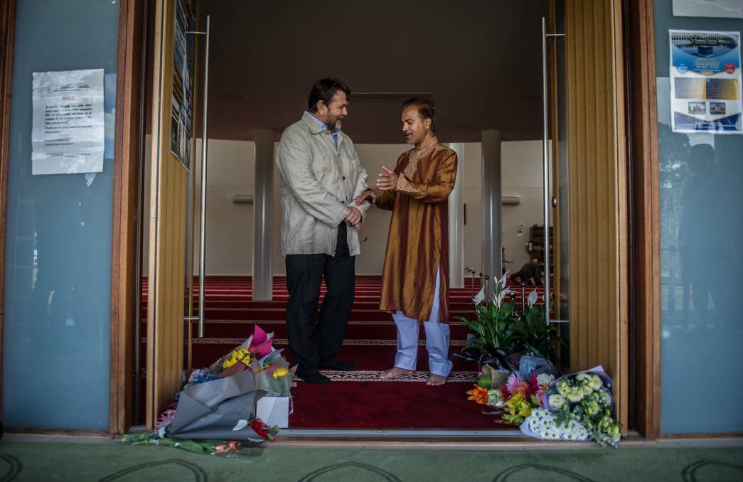 Christchurch man Paul Bradley speaks to Canberra Muslim Community president Mainul Haque at Gungahlin Mosque on Saturday. Photo: Karleen Minney
