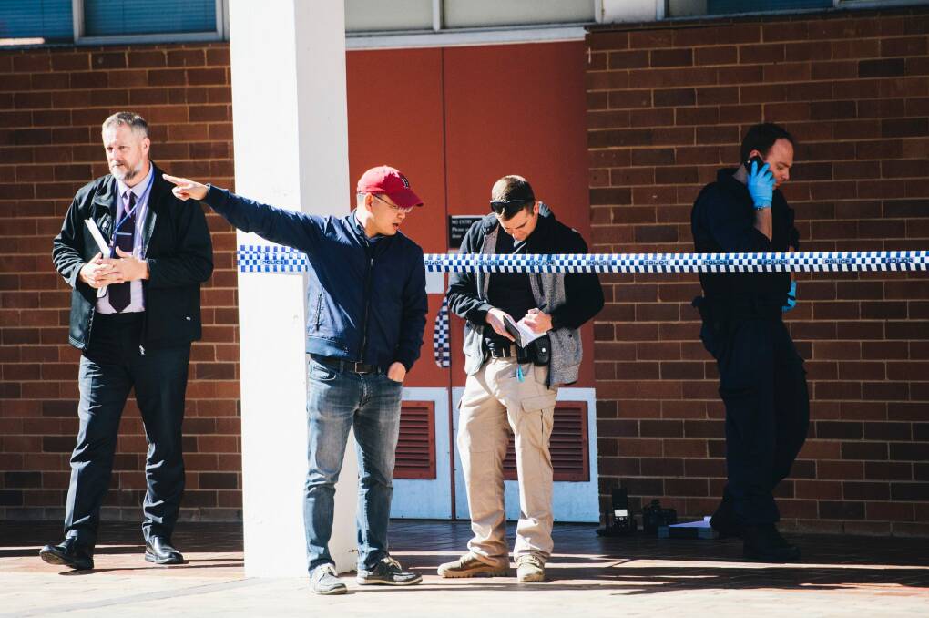 Scenes at the ANU after a man was arrested after allegedly attacking several people with a baseball bat in the Copland building. Photo: Rohan Thomson