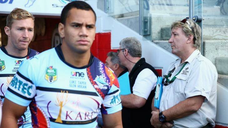 Watchful eye: ASADA officials stand in the tunnel as Cronulla players run out onto Remondis Stadium. Photo: Getty Images