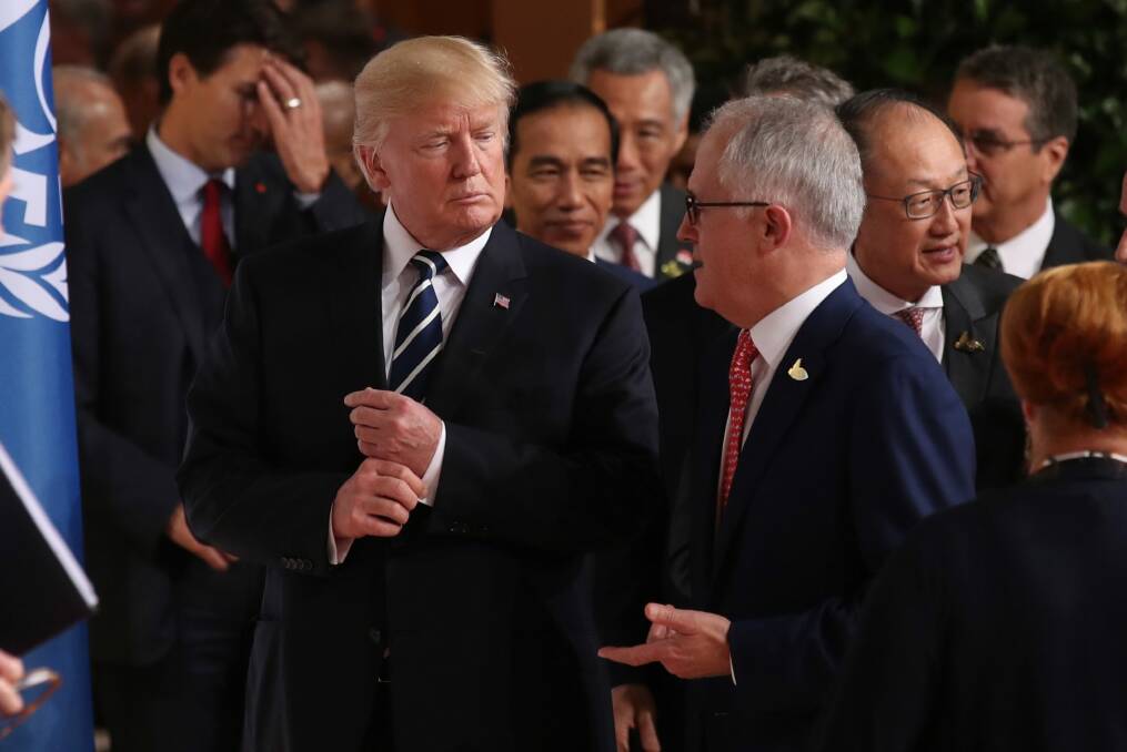 Australian Prime Minister Malcolm Turnbull walks with US President Donald Trump to the G20 family photo. Photo: Andrew Meares