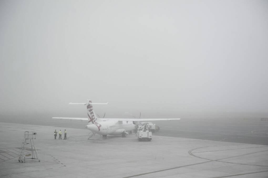 Heavy fog caused minor delays to flights at Canberra Airport.
 Photo: Jay Cronan
