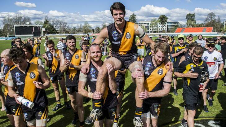 Queanbeyan Tigers players chair retiring clubman Roy Jarques from the field after the loss to the Brisbane Lions reserves. Photo: Rohan Thomson