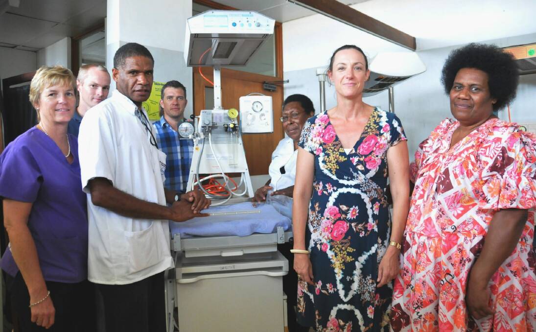 Saving babies: From left are Christine Jackson, Australian government-funded midwives trainer; Scott Everden, Australian government-funded medical engineer; Sam Mahit, maternity ward assistant manager;  Scott Monteiro, Australian government-funded procurement manager; Jeannette Barry, maternity ward manager; Tanya Parkin, Australian deputy high commissioner; and Leipakoa Matariki, Vila Central Hospital manager with a resuscitaire. Photo: Yohann Lemonnier