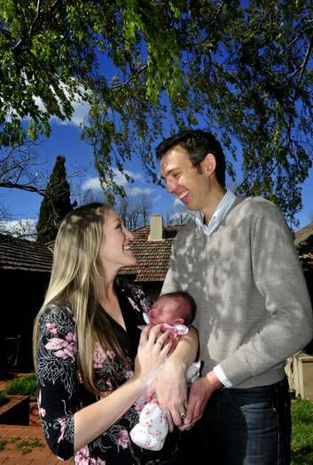 Entrepreneur Alex Mair at home with wife Irene and baby Hannah. Photo: Melissa Adams