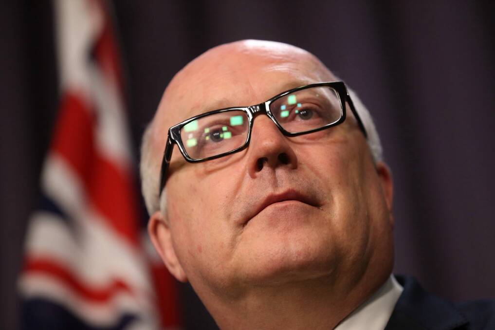 Attorney-General George Brandis has been criticised for funding cuts to community legal centres in last week's budget Photo: Andrew Meares